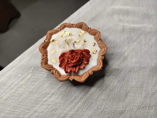 Red flower diya candle 