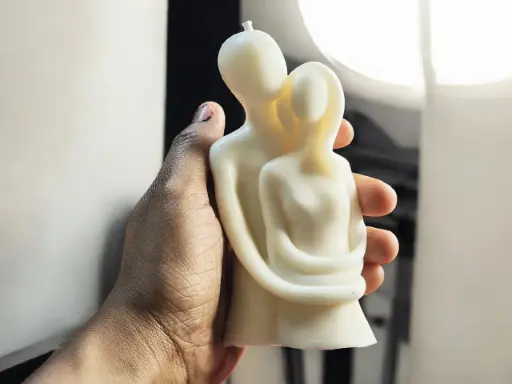 Hugging couple candle